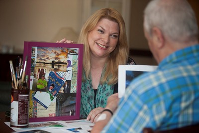 PENDINE PARKS Artist in Residence Sarah Edwards working on a Memory Board with one of the residents.