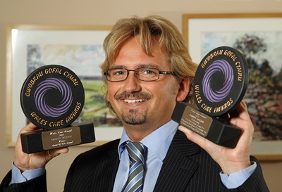 PICTURE BY PATRICK OLNER 07958 546063Darren Jackson Principal of Ludlow-Orbis Group with the two prestigious awards he won at the Wales Care Awards