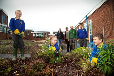 Cadwyn Clwyd have funded a wildlife garden at Ysgol Bro Carmel Holywell. Pictured from left are pupils Jacob Jones, Ailah Davies, William James and Oscar Ashbrook along with (from left) Sarah Jones - Environment and Heritage Officer, teacher Miss Jones and Roger Pawling, Volunteer for North Wales Wild Life Trust.