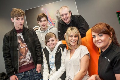 Eagles Meadow Mum in a Million competition winner Jackie Jenkins,  along with her daughter Kiera Leanne Jenkins, who nominated her for the prize, dad Karl and brothers Jordan and Kyle pictured with therapist Laura Owen at Gozo