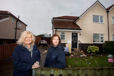 Antisocial Behavour Officer Jan Jones at a  repossessed property in Rhos-On-Sea with Case worker Linda Lewis.