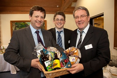 Welsh Government Deputy Minister for Food Alun Davies at the launch of the Clwydian Range Food Trail . Deputy Minister For Food Alun Davies is presented with a food hamper from Robert Price, Cadwyn Clwyd Agri-Food Project Officer for Denbighshire and Flintshire, and David Jones, Chairman of the Food Trail.