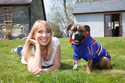 Donna Condliffe who runs Canine and Co. Pictured With buster the British bull dog cross in one of the jubilee outfits.