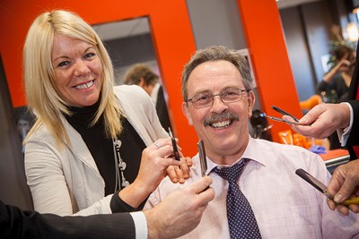 Eagles meadow Shopping Centre Manager Kevin Critchley shaves off his Movember Mustache. Pictured is kevin Critchley with Sharon Hughes from Gozo.