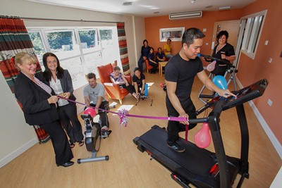 Pendine Parks Bodlondeb opening of new Gym for residents and staff by Paula Jenkins Workplace Health advisior for public Health Wales. Pictured from left is Ann Chapman Manager at Bodlondeb with Paula Jenkins, workplace health advisor for public health Wales and staff member Jigger Cortez on the treadmill along with other staff members and residents at the official opening.