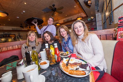 Enjoying the breakfast special at Frankie and Bennys in Eagles Meadow, Wrexham are from left, Christine Minshaw,Rebecca Cadwallader, Tracey Thornley and Debbie Evans with manager Peter Cross.