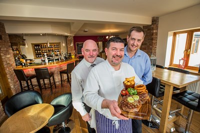 Joe Lynch and Leigh O'Brien, right of Con Amici in Denbigh with Terry Davies, left from Williams of Flint Butchers.