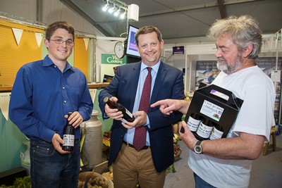 CADWYN CLWYD EISTEDFFOD 2013, MINISTER ALUN DAVIES VISIT. Pictured is Robert Price, Cadwy Clwyd, minister Alun Davies and Alyn Ashworth head brewer at Denbigh Brewery.