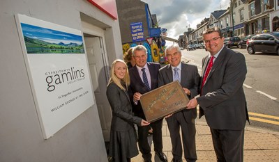 Law firms unite. One set up by Lloyd George and based in Porthmadog has merged with Gamlins. Pictured outside the offices in Porthmadog, from left, Kelly Haynes, Vernon Oliver, Phil George and Mark Salisbury