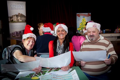 Cartrefi Conwy Christmas Consultation Event for the residents in and around Llys Seiriol/Llys Eryl  . pictured are residents Linda Mullin and Martin Stallard with (CENTRE) Nerys Veldhuizen, Cartrefi Conwy.