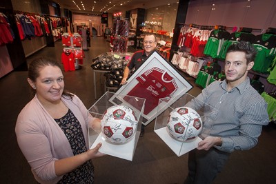 EAGLES MEADOW , WREXHAM W.F.C SHOP. Pictured is Esther Dooley, Mike Griffiths and  Shop Manager Steve Cooke.