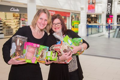 Miriam Salas and Sharon Griffiths from the Management Suite at Pride Hill with some of the prizes for the Easter Egg Hunt