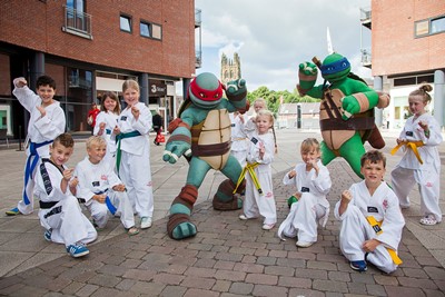 Teenage Mutant Ninja Turtles visit Eagles meadow Wrexham. Pictured are Turtles Leo and Raph with members of Hope Wrexham Tae Kwon-do (TKD) Club .