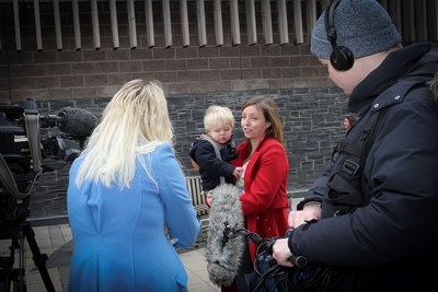 Eagles Meadow, Wrexham. Boom Cymru Television filiming at Eagles Meadow. New series on S4C. Pictured: Elen Williams and her son, Iestyn Williams 21 months old from Rhos being interviewed by Presenter Nia Parry.